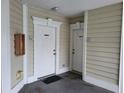 Building entrance featuring two white painted doors, door numbers, and no smoking signs at 330 S Middleton Dr. # 603, Calabash, NC 28467