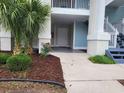 Beautiful entrance with well-kept landscaping and a front door at 330 S Middleton Dr. # 603, Calabash, NC 28467