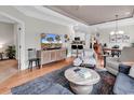 Open-concept living room with wood floors, decorative accents, and a view of the kitchen at 35 Delray Dr. # 3A, Murrells Inlet, SC 29576