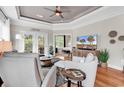 Cozy living room with modern decor, comfortable seating, and a view to a screened porch at 35 Delray Dr. # 3A, Murrells Inlet, SC 29576