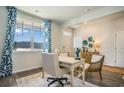 Well-lit home office with a desk, chairs, large window, and tasteful decor at 3575 Ashridge Way, Conway, SC 29526