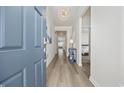 Inviting entryway with hardwood floors, elegant lighting, and stylish decor at 4206 Falls Oaks St., Myrtle Beach, SC 29579
