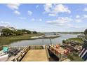 Cozy backyard deck with outdoor seating, perfect for relaxing and enjoying waterfront views at 465 Vereen Rd. # 10, Murrells Inlet, SC 29576