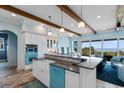 Bright kitchen with custom cabinets, a breakfast bar, and ocean views at 4900 N Ocean Blvd., Myrtle Beach, SC 29577