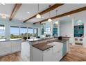 Spacious kitchen with exposed beams, custom cabinets, and views of the ocean at 4900 N Ocean Blvd., Myrtle Beach, SC 29577