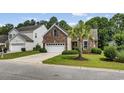 A well-maintained lawn and plantings enhance the curb appeal of this charming brick home at 5149 Morning Frost Pl., Myrtle Beach, SC 29579