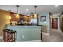 A cozy kitchen with stainless steel appliances, granite counters, and bar seating is perfect for entertaining at 603 S Ocean Blvd. # 1205, North Myrtle Beach, SC 29582