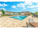 Sparkling community pool with comfortable lounge chairs and a covered seating area at 617 Chiswick Dr., Conway, SC 29526