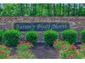 Beautiful community sign with lush greenery and vibrant flowers at 617 Chiswick Dr., Conway, SC 29526