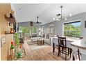 Bright living room with vaulted ceilings, hardwood floors, and comfortable seating at 639 Waterway Village Blvd # 14-I, Myrtle Beach, SC 29579
