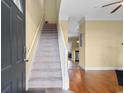Inviting foyer with hardwood floors, a carpeted staircase, and a view into the kitchen at 788 Gabreski Ln. # B4, Myrtle Beach, SC 29577