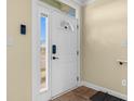 Bright foyer featuring a secure coded front door with sidelight and tiled floor at 788 Gabreski Ln. # B4, Myrtle Beach, SC 29577