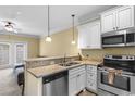 Stylish kitchen with granite countertops, stainless steel appliances, and a breakfast bar at 788 Gabreski Ln. # B4, Myrtle Beach, SC 29577