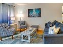 Well-decorated living room featuring comfortable seating, an artistic rug, and a decorative center table at 1212 Ocean Blvd. S # 202, Surfside Beach, SC 29575