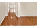 A hallway featuring beautiful hardwood floors and open archways that lead into well-lit rooms at 126 Dreamland Dr., Murrells Inlet, SC 29576