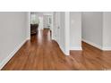 Inviting hallway showcases beautiful hardwood flooring and neutral paint at 133 Deloach Trail, Pawleys Island, SC 29585