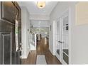 Inviting entryway with wood floors, glass French doors, and views of the living area at 1331 Winding Creek Way, Myrtle Beach, SC 29588