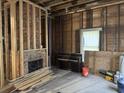 Living room undergoing renovation, featuring exposed brick, wooden frame and rustic charm at 1403 9Th Ave., Conway, SC 29526