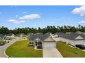 Aerial view of a neighborhood with well-maintained homes and lush green lawns at 177 Baylee Circle, Galivants Ferry, SC 29544