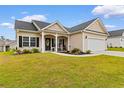 Attractive single-Gathering house featuring a welcoming front porch and a two-car garage at 177 Baylee Circle, Galivants Ferry, SC 29544