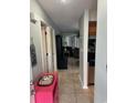 Hallway that looks into living room and kitchen with tiled floor at 201 Hillside Dr. N # 111, North Myrtle Beach, SC 29582