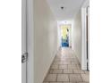 Hallway with tiled floor leading to a bright room at 2511 S Ocean Blvd. # 507G, Myrtle Beach, SC 29577