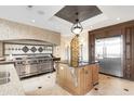Gourmet kitchen with custom island, stainless steel appliances, and designer lighting at 2715 Ships Wheel Dr., North Myrtle Beach, SC 29582
