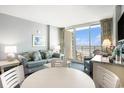 The living room features a sofa, chair, round table, and balcony with ocean views at 300 N Ocean Blvd. # 723, North Myrtle Beach, SC 29582