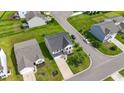 Aerial view of a well-maintained two-story home in a residential neighborhood with green lawns at 4115 Alvina Way, Myrtle Beach, SC 29579