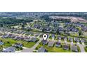 Aerial view of a well-maintained two-story home in a residential neighborhood with green lawns at 4115 Alvina Way, Myrtle Beach, SC 29579