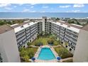Soak up the sun and enjoy the stunning aerial view of this condo and pool overlooking the ocean at 423 Parker Dr. # 334, Pawleys Island, SC 29585