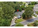 An aerial view highlighting the home's location within the neighborhood near the golf course and water feature at 4314 Turtle Ln., Little River, SC 29566