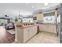 Eat-in kitchen featuring white cabinetry, tile backsplash, and neutral countertops at 4820 Magnolia Lake Dr. # 305, Myrtle Beach, SC 29577