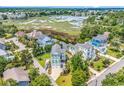 Scenic aerial view of the home nestled among lush greenery, showcasing its peaceful neighborhood and water views at 601 46Th Ave. S, North Myrtle Beach, SC 29582