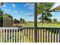 Screened balcony featuring a scenic golf course view, perfect for outdoor relaxation and enjoying nature at 6010 Windsor Green Way # 301, Myrtle Beach, SC 29579