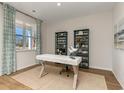 Bright office space featuring a decorative desk, stylish bookshelves, and ample natural light from the window at 739 Chazen Way, Longs, SC 29568