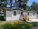 Charming single-story home with gray siding, white trim, and new wood porch at 800 Columbia Dr., Myrtle Beach, SC 29577