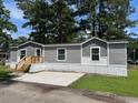 Charming single-story home with gray siding, white trim, and new wood porch at 800 Columbia Dr., Myrtle Beach, SC 29577