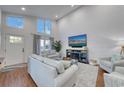 Spacious living room with soaring ceilings, plenty of natural light, and a unique textured accent wall at 800 S 9Th Ave. S # A-1, North Myrtle Beach, SC 29582