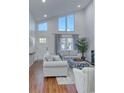 This bright living room boasts high ceilings, tall windows, and a decorative textured wall at 800 S 9Th Ave. S # A-1, North Myrtle Beach, SC 29582