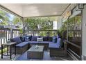 Cozy covered patio with comfortable wicker furniture and a coffee table perfect for outdoor relaxation at 88 Salt Marsh Circle # 22F, Pawleys Island, SC 29585