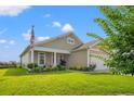 Inviting single-Gathering home with a well-kept lawn and cozy front porch at 915 Sorano St., Myrtle Beach, SC 29579