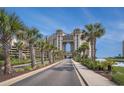 Scenic exterior view of the building with palm trees lining the street at 100 North Beach Blvd. # 710, North Myrtle Beach, SC 29582