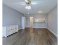 Living room featuring hard surface floors, ceiling fan, and an open concept kitchen at 1100 Possum Trot Dr. # D106, North Myrtle Beach, SC 29582