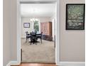 Traditional dining room featuring carpeted floors, and neutral paint tones at 110-1 Whitetail Way # 1, Pawleys Island, SC 29585