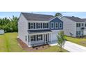 Charming two-story home featuring a well-manicured lawn and a two-car garage at 1102 Boswell Ct., Conway, SC 29526