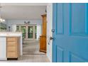 Bright entryway showcases an open floor plan with a view into the living area and outdoor balcony at 1221 Tidewater Dr. # 122, North Myrtle Beach, SC 29582
