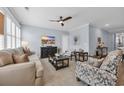 Comfortable living room with a ceiling fan, plantation shutters and stylish furnishings at 1352 Jolly Roger Dr., North Myrtle Beach, SC 29582
