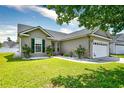 Well-maintained home with green shutters and lovely landscaping at 1412 Reid Ct., Myrtle Beach, SC 29588