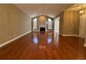 Spacious living room featuring vaulted ceilings and a cozy fireplace at 1428 Saint Thomas Circle # B-1, Myrtle Beach, SC 29577